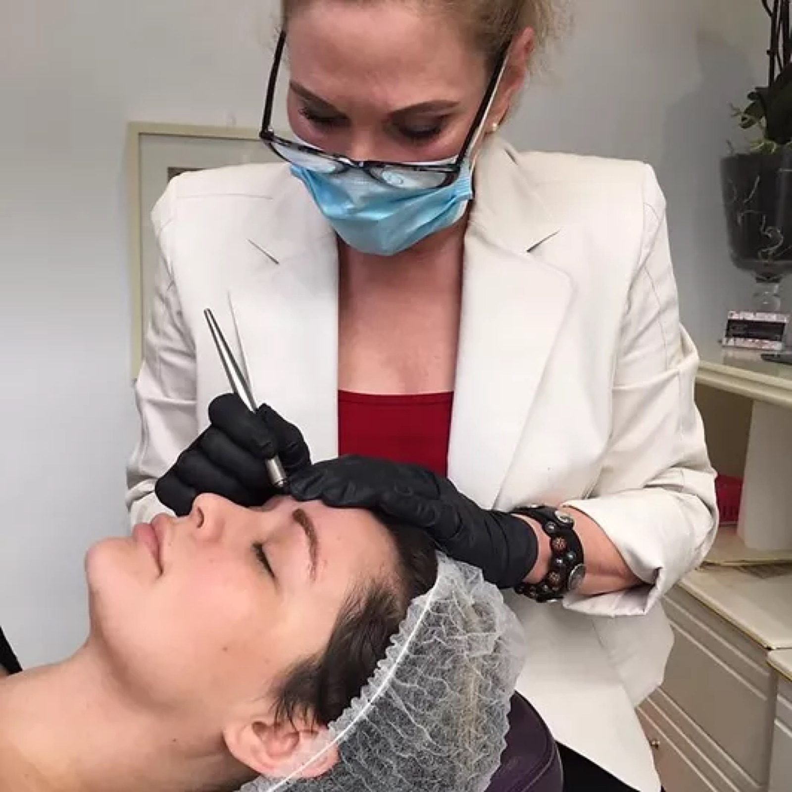 Brenda performing a cosmetic tattooing procedure